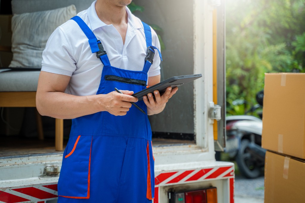 Move coordinator using a tablet to plan delivery logistics